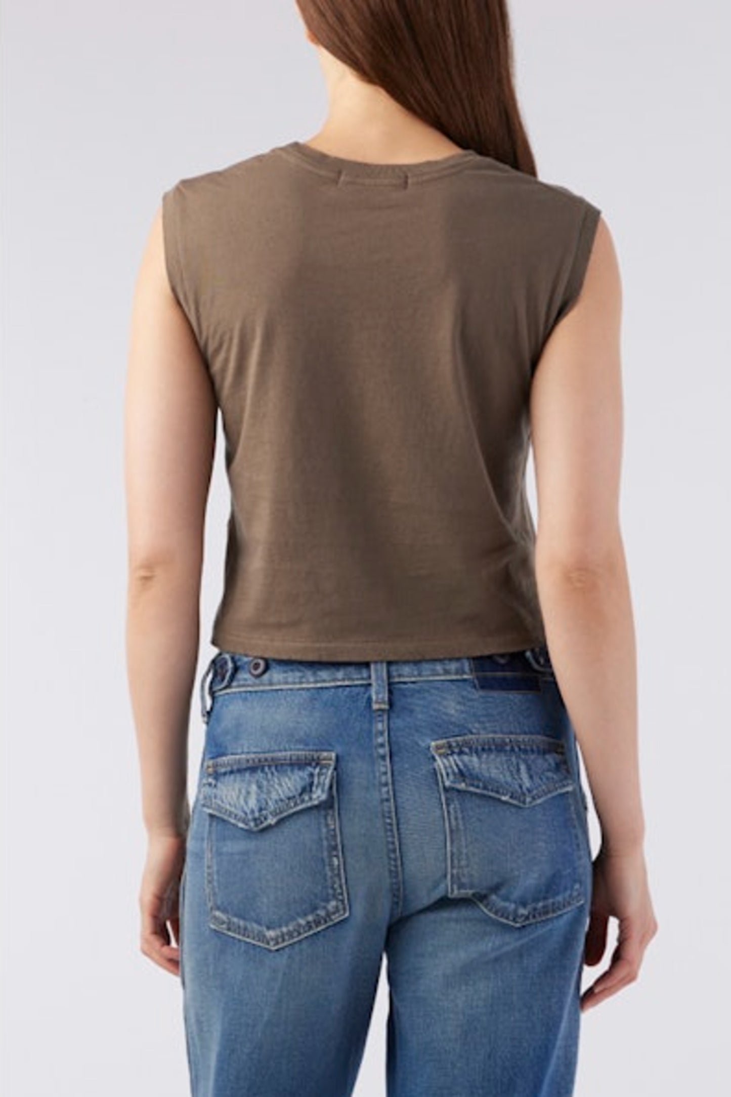 Image of model wearing AMO Denim Babe Sleeveless Cropped Tee in Coffee Brown. Babe Tee is a muscle style sleeveless tee with a crew neck and cropped length. Designed and produced in Los Angeles.