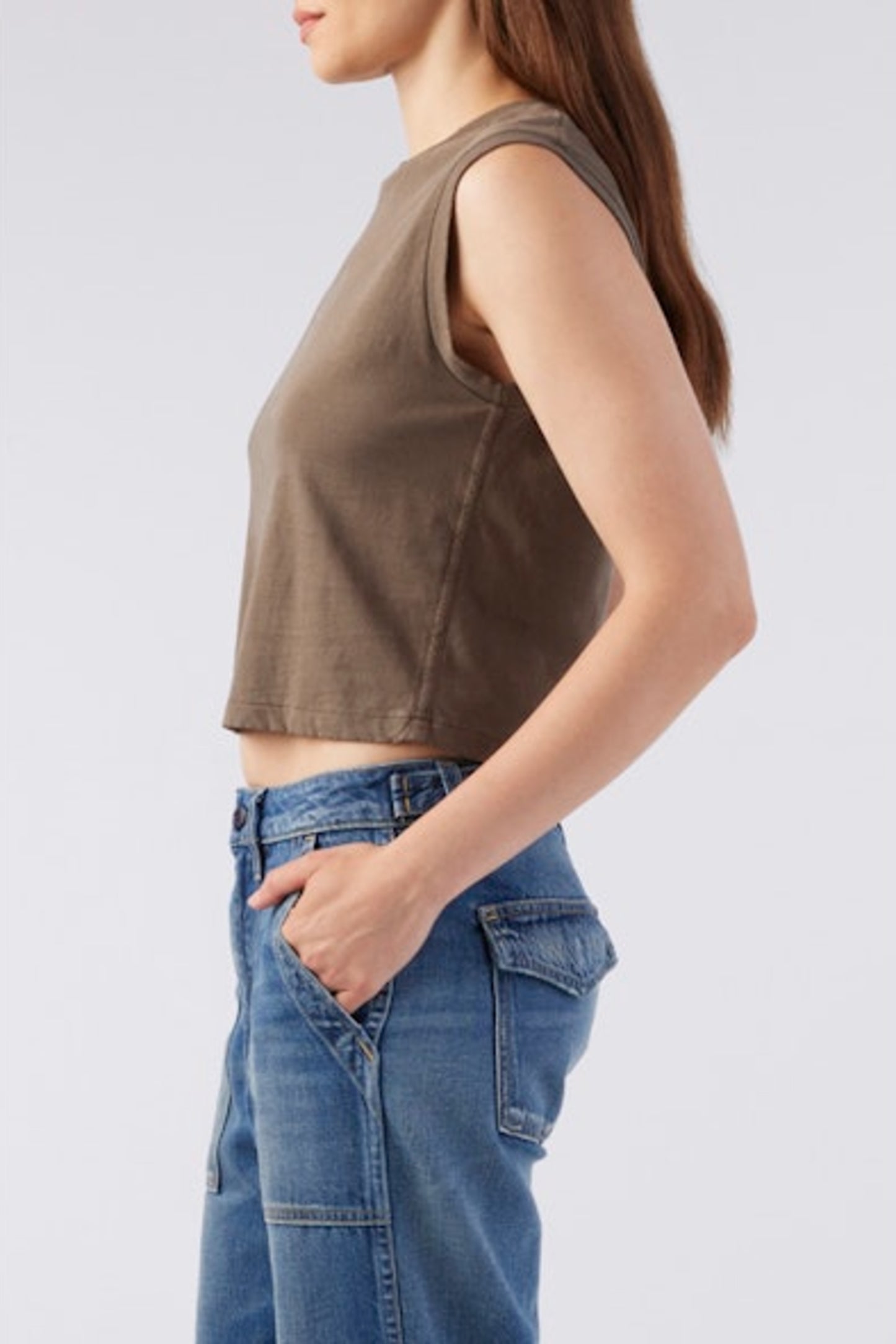 Image of model wearing AMO Denim Babe Sleeveless Cropped Tee in Coffee Brown. Babe Tee is a muscle style sleeveless tee with a crew neck and cropped length. Designed and produced in Los Angeles.
