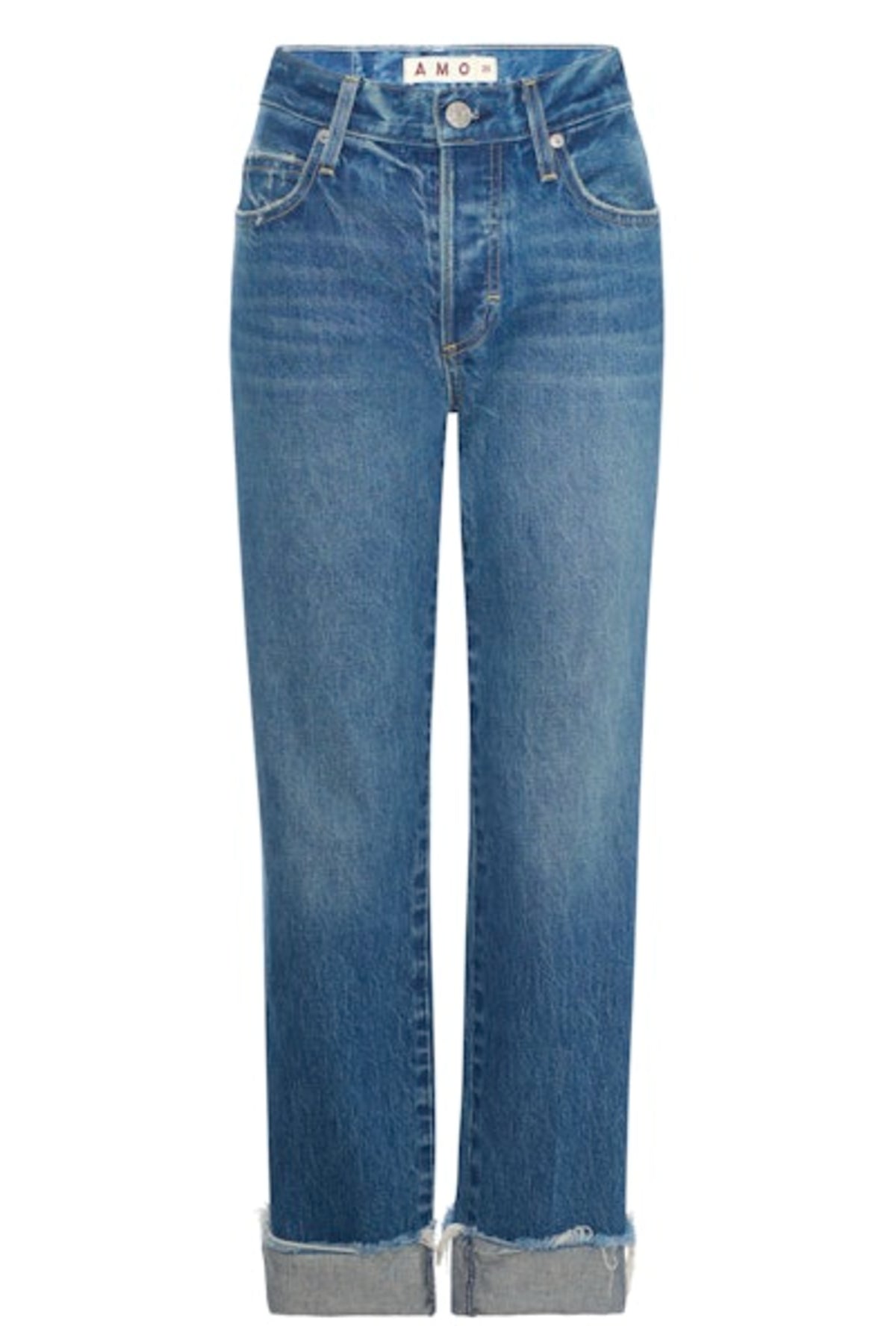Image of model wearing AMO DENIM Camryn Jean in Magnetic. Cameron is a mid-rise 100% Cotton mid-wash denim with a tapered, straight leg opening. Designed to wear with cuffed hem.