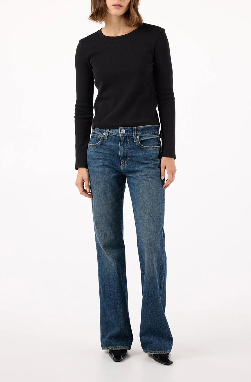 Image of model in AMO Denim 90s inspired Marcenia Cotton Low Rise Boot Cut Jeans - Ethically Made Fashion - Made in USA Women's Apparel