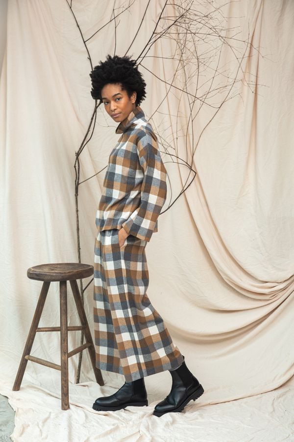 Image of model wearing BEAUMONT ORGANIC Evora Leigh Trouser in Recycled Cotton Brushed Twill in Tan and Charcoal Check.