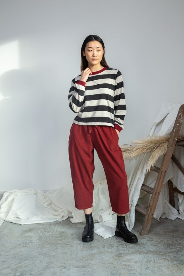 Image of model wearing BEAUMONT ORGANIC Sierra Sue Long Sleeve Striped Tee in Charcoal and White Organic Cotton.