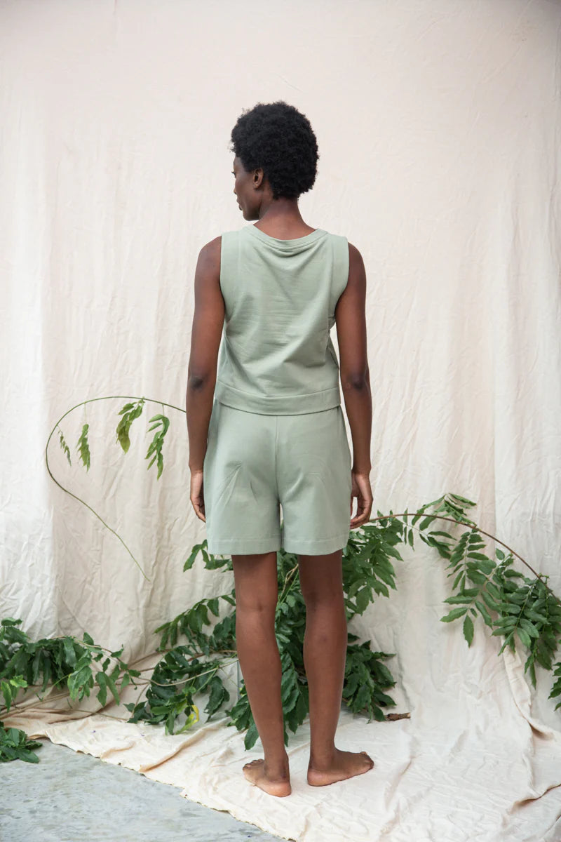 Image of model wearing Beaumont Organic Sylvia Lounge Short in Pistachio Green Felpe Cotton. Sylvia is a relaxed fitting pull-on lounge short that hits mid-knee length. Ethically made in Portugal from organic Cotton.