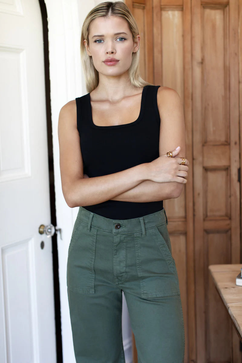 Image of model wearing EMERSON FRY Vintage Long Army Pant in Green Cotton.