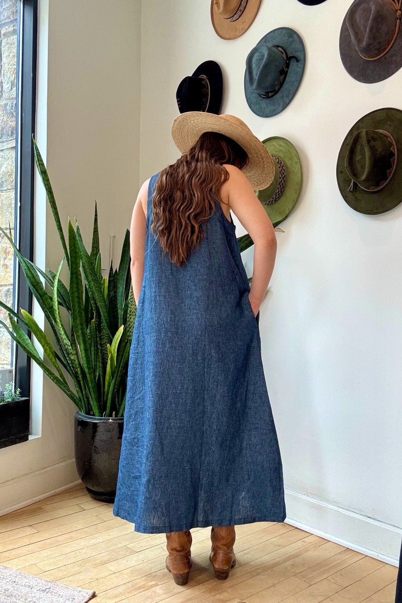 Image of IT IS WELL LA Linen Strap Sundress in Indigo. This dress has a square neckline + back, thick straps, hidden side pockets, and hits midi length. Made in USA.