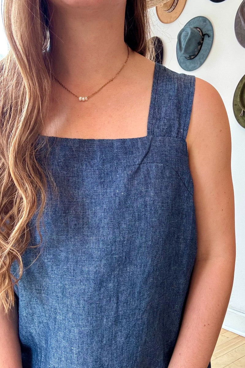 Image of IT IS WELL LA Linen Strap Sundress in Indigo. This dress has a square neckline + back, thick straps, hidden side pockets, and hits midi length. Made in USA.