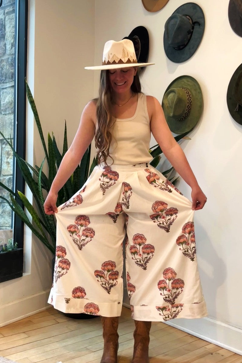 Image of model wearing MAELU DESIGNS Hand Block Printed Fleur Cotton Pant. Fleur Pants are a wide cut, culotte style trouser with a cropped length and all over floral print.