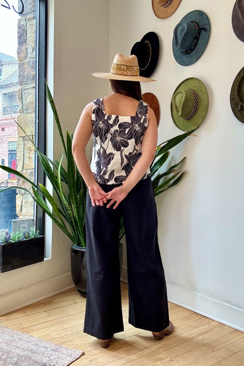 Image of NARY RESORT Koh Rong Lounge Pant in Black Deadstock Linen. These pants have a high rise, frilled drawstring waist, and a full inseam with a wide leg opening. Ethically made in Cambodia.