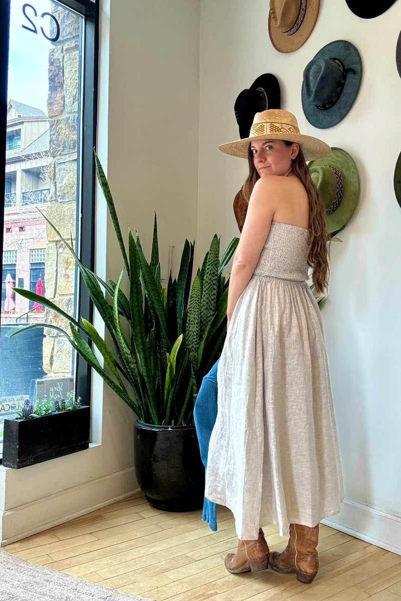 Image of NARY RESORT Shirred Tube Midi Sundress in Grey Stripe Deadstock linen. This midi length dress has a gathered, pintuck bodice, a-line skirt, and side pockets. Ethically made in Cambodia.