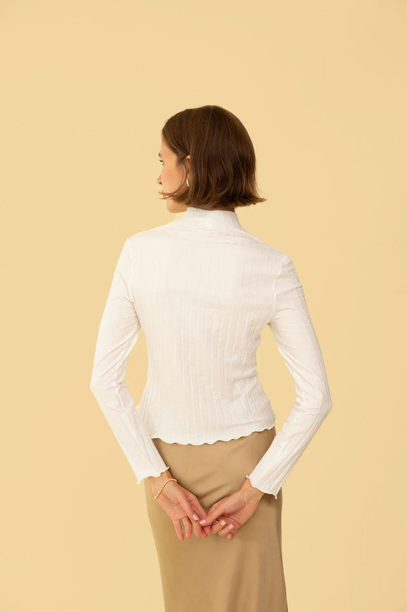 Image of model in Whimsy Row Cream Eco-Rib Gigi Mockneck Top _ Eco-Friendly Women's Fashion Brands _ Made in Los Angeles USA Women's Apparel