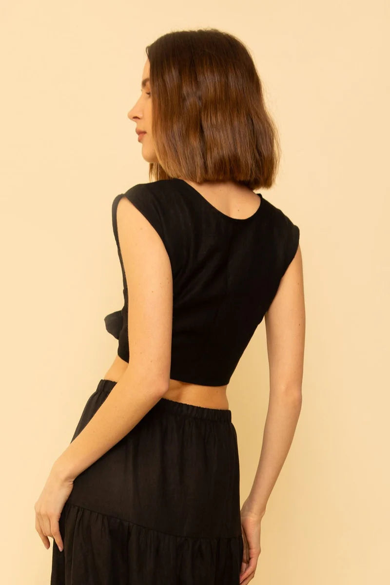 Image of model wearing Whimsy + Row Valentina Tie Top in Black Linen. Valentina Top is a square shoulder crop top with tie closure that can be worn back to front. Made in Los Angeles.