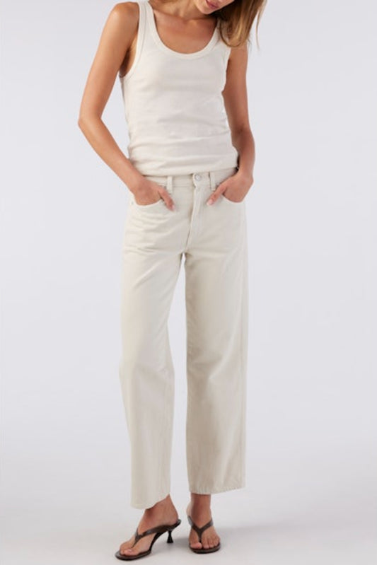 Image of model wearing AMO Denim Billie Straight Leg Jean in Sandstone (Natural White). Billie is a mid rise relaxed fit 100% Cotton Jean with a slight crop. Designed and made in Los Angeles.