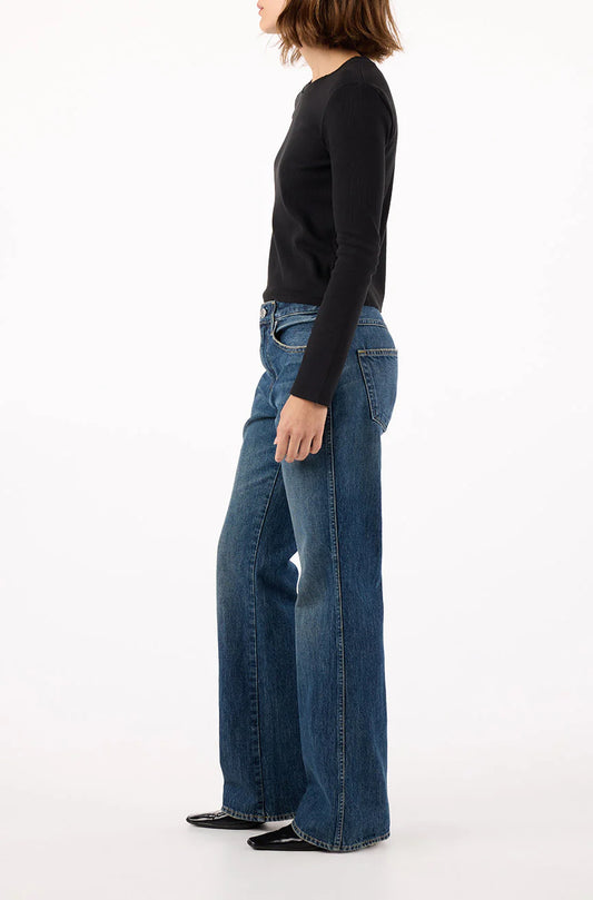 Image of model in AMO Denim 90s inspired Marcenia Cotton Low Rise Boot Cut Jeans - Ethically Made Fashion - Made in USA Women's Apparel
