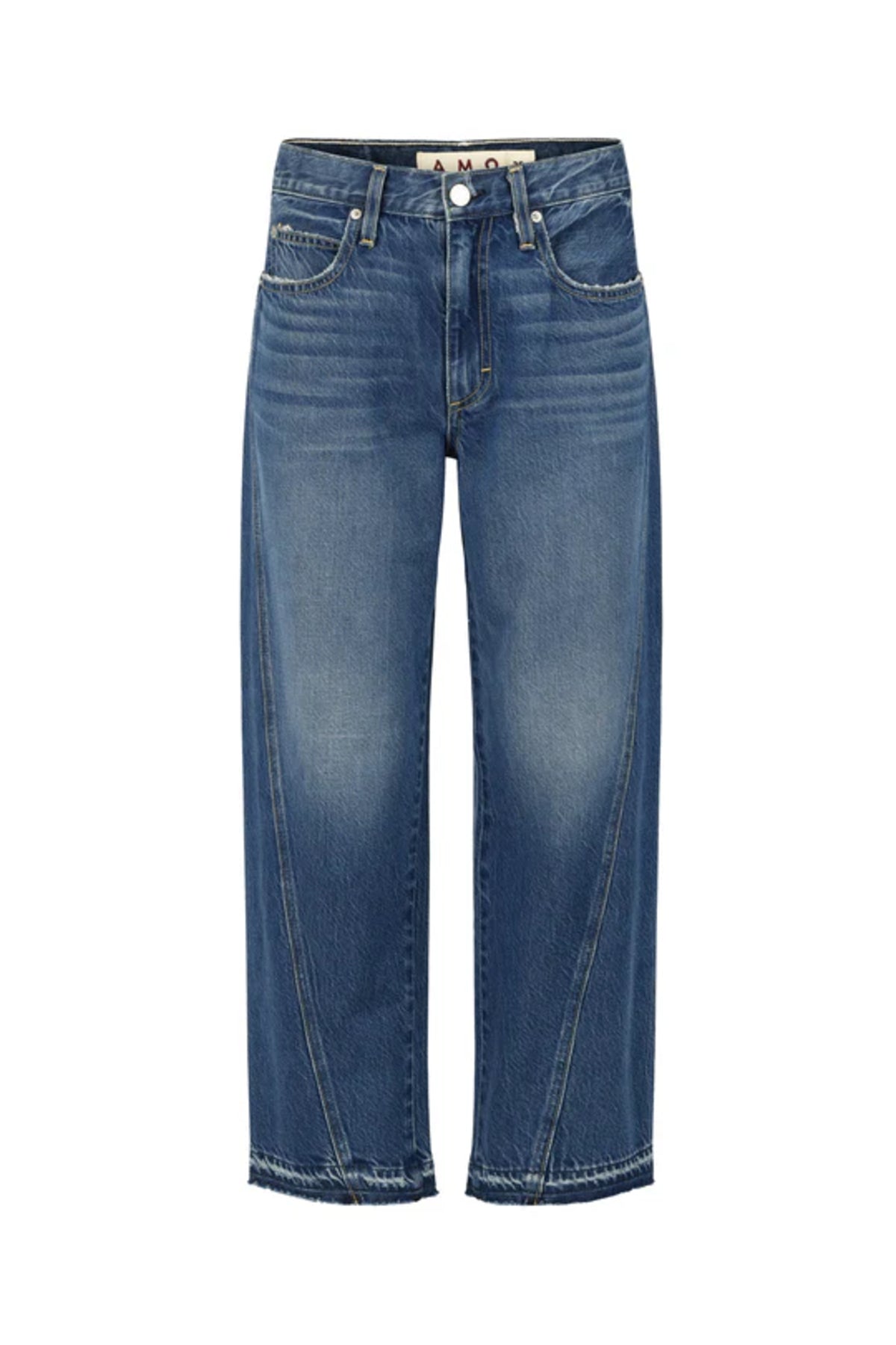 Image of model wearing AMO Denim Maria Barrel Jean in Long Weekend Wash. Maria is a cropped, raw hem Jean with a twisted seam giving a barrel leg silhouette. Made in USA. 
