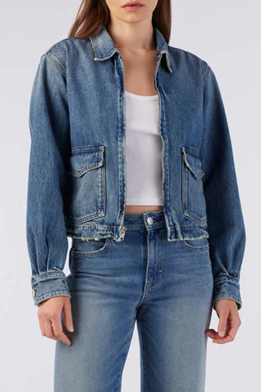 Image of model wearing AMO Denim Sally Zip Front Jean Jacket in Maverick Light Wash. Made in USA premium denim and basics. Femaled founded and operated.