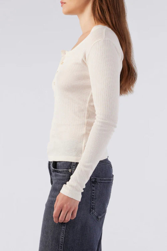 Image of a model wearing AMO Denim Sweets Henley in Bone (Natural White). Sweets Henley is a Premium Scoop Neck Cotton Henley with tonal button details and subtle ribbing. Made in Portugal.