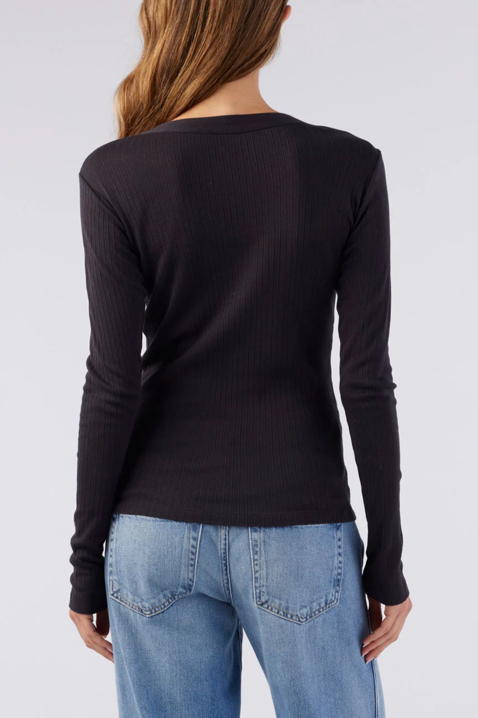 Image of a model wearing AMO Denim Sweets Henley in Vintage Black. Sweets Henley is a Premium Scoop Neck Cotton Henley with tonal button details and subtle ribbing. Made in Portugal. 