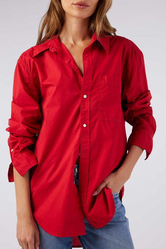 Image of model wearing AMO Denim Ruth Oversized Button Down Shirt in Cherry Red Cotton Poplin. Made in Peru premium women's denim and basics. Female founded and operated.