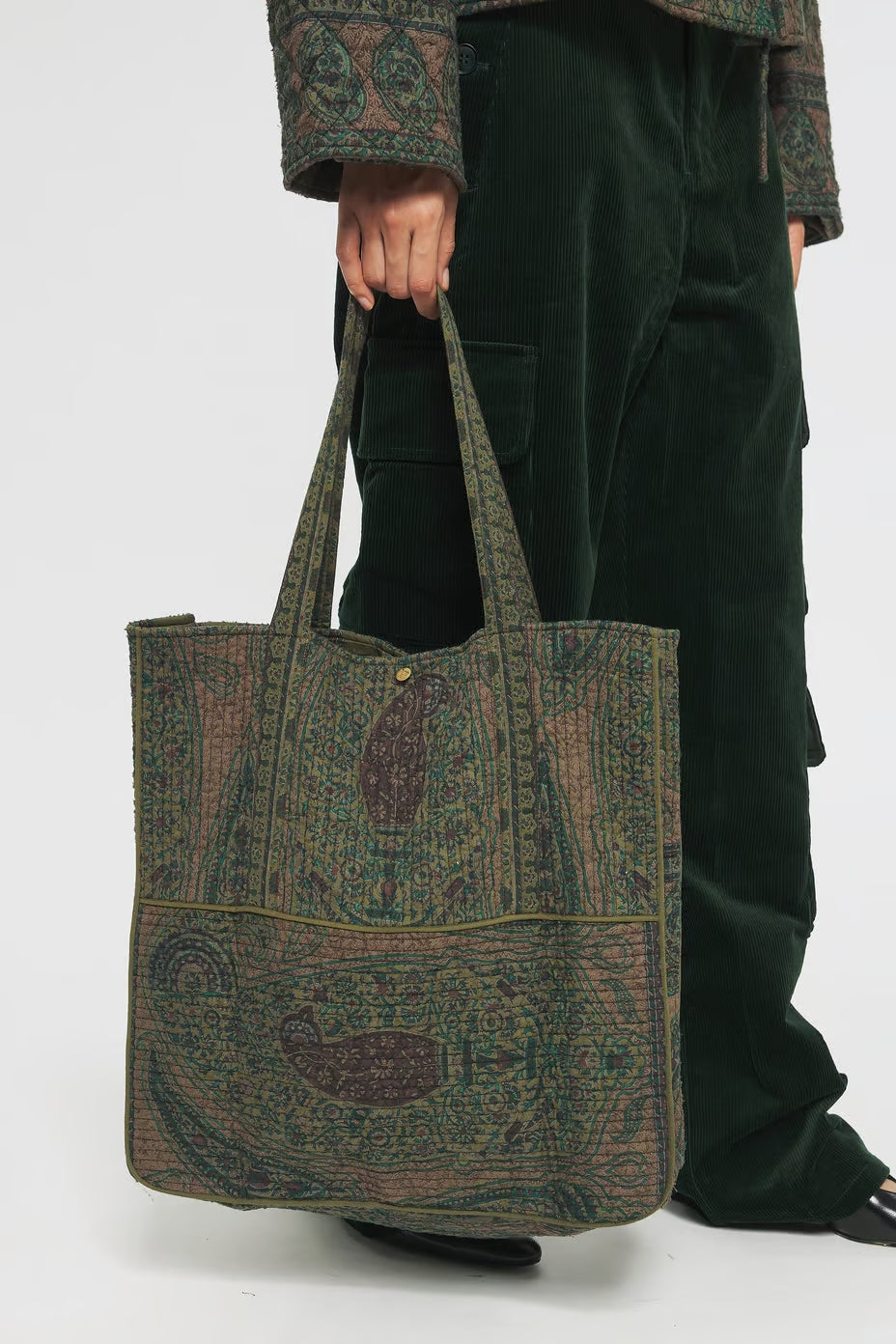 Image of model holding Antik Batik Hand Quilted Cotton Carry-On Tote Bag with Green Paisley Block Print Pattern - Ethically Made French Fashion - Artisan Made Sustainable High Fashion