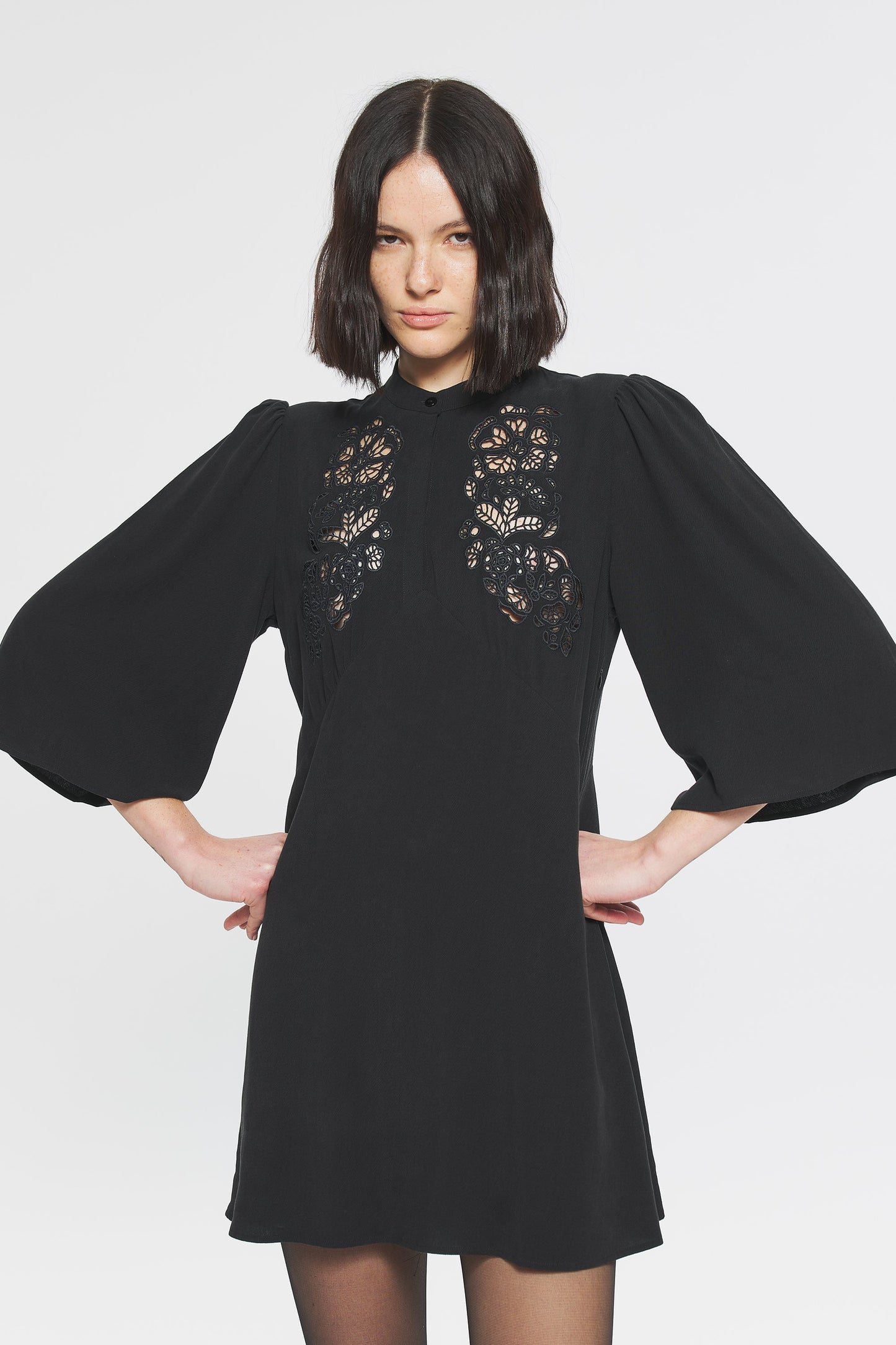 Image of model in Antik Batik Marina Little Black Dress with Flutter Sleeves and Eyelet Details on Bodice _ Ethical French Bohemian Fashion _ Artisan Made Sustainable High Fashion