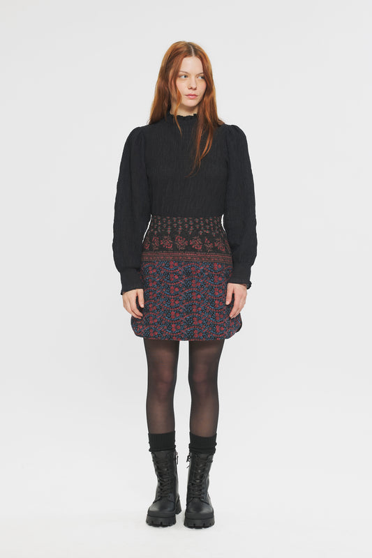 Image of model in Antik Batik Irina Quilted Cotton Jacquard Floral Block Print Winter Mini Skirt _ Ethical French Bohemian Fashion _ Artisan Made Sustainable High Fashion