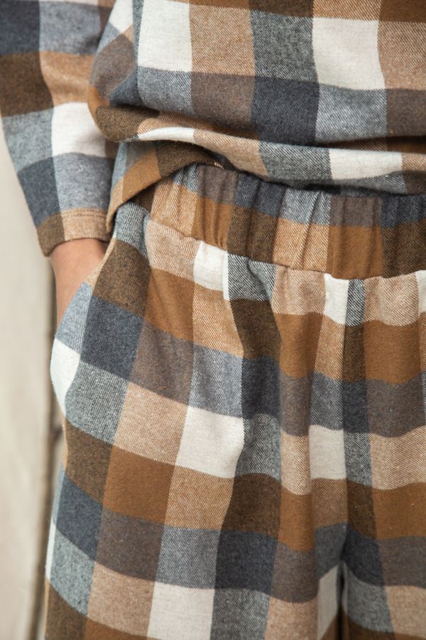 Image of model wearing BEAUMONT ORGANIC Evora Leigh Trouser in Recycled Cotton Brushed Twill in Tan and Charcoal Check.