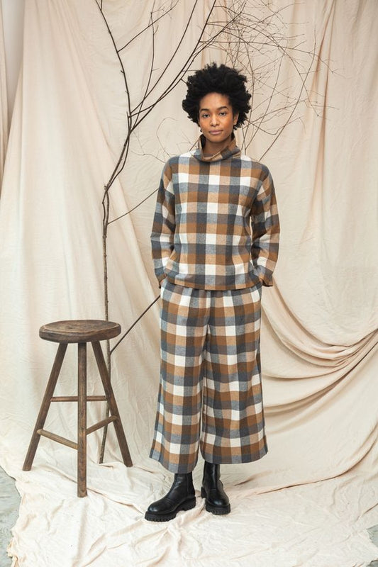 Image of model wearing BEAUMONT ORGANIC Evora Leigh Trouser in Recycled Cotton Brushed Twill in Tan and Charcoal Check.