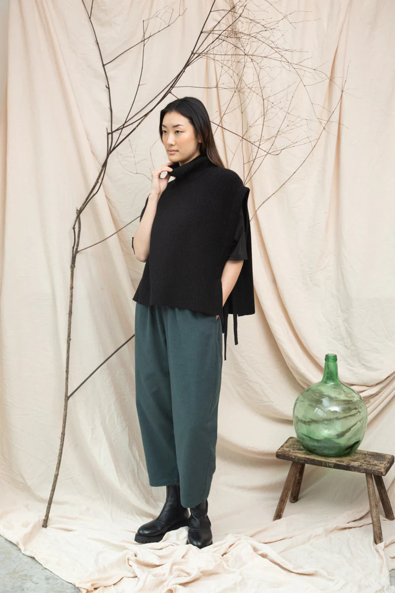 Image of model wearing BEAUMONT ORGANIC Kanon Reyclced Wool Knit Vest in Black.