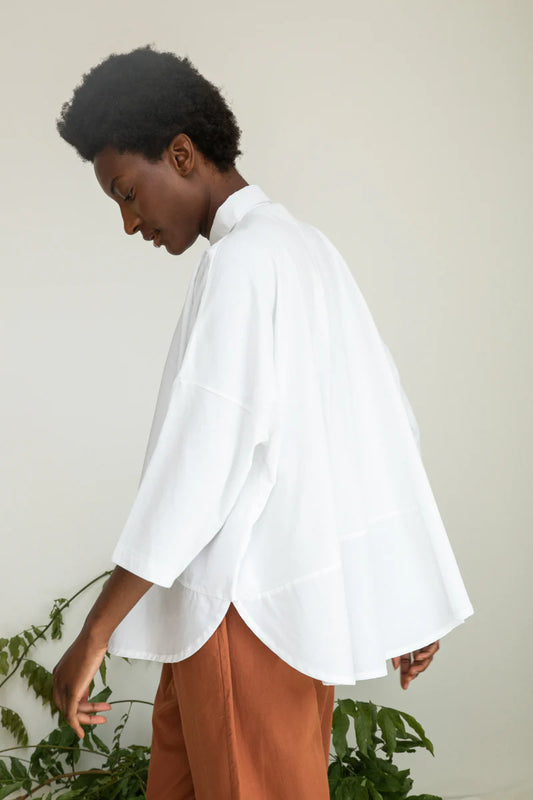 Image of model wearing BEAUMONT ORGANIC Lissie Button Down in White. Lissie is a 3/4 sleeve length boxy button down made from organic Cotton poplin and cotton jersey. 