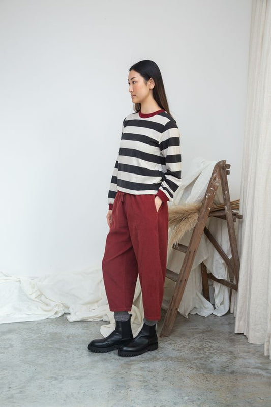 Image of model wearing BEAUMONT ORGANIC Sierra Sue Long Sleeve Striped Tee in Charcoal and White Organic Cotton.