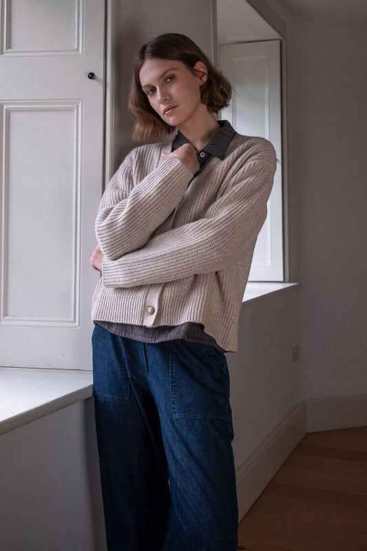 Image of model wearing BIBICO Fair Trade Clothing Adita Ribbed Cardigan in Natural White Wool