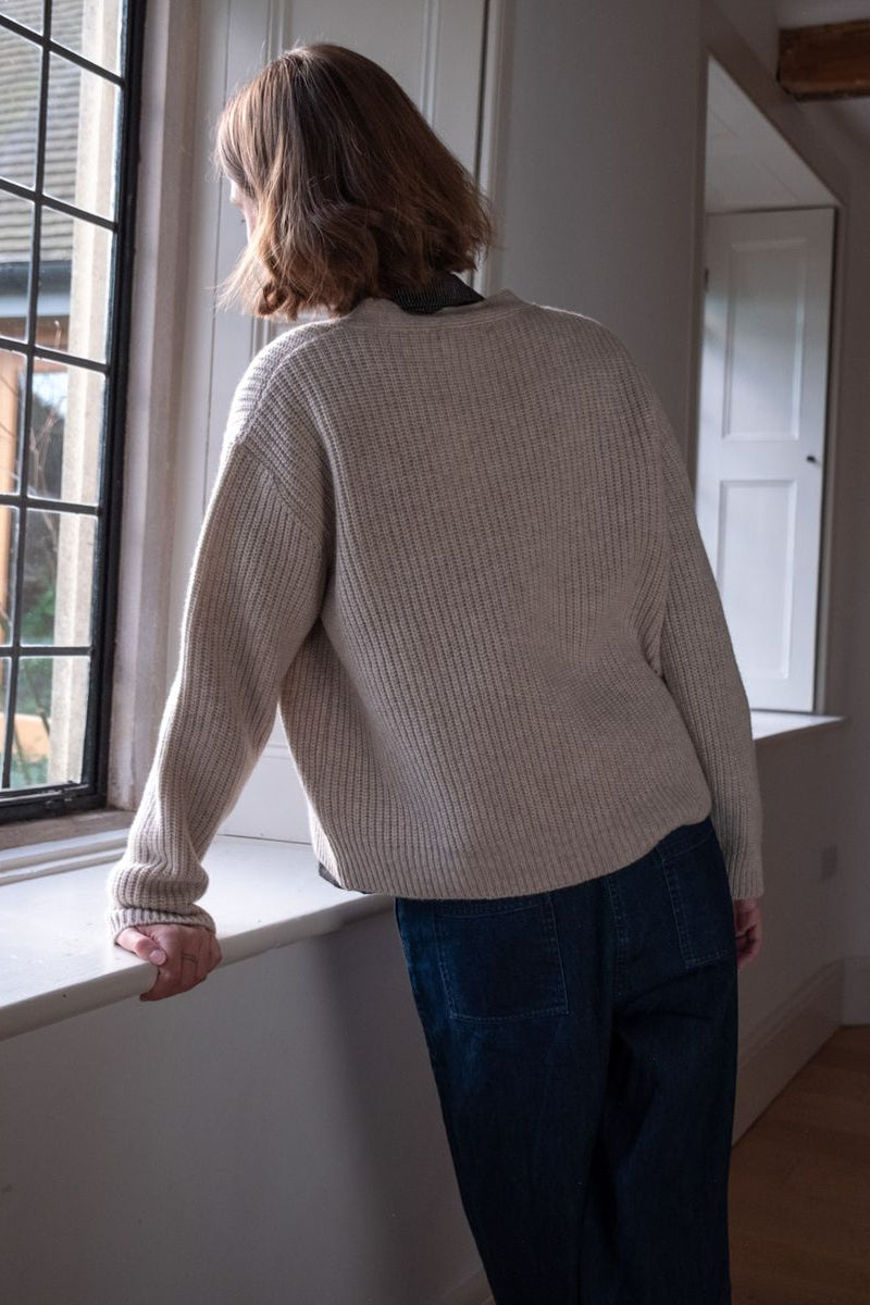 Image of model wearing BIBICO Fair Trade Clothing Adita Ribbed Cardigan in Natural White Wool