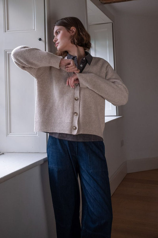 Image of model wearing BIBICO Fair Trade Clothing Adita Ribbed Cardigan in Natural White Wool