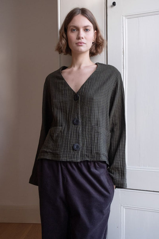 Image of model wearing BIBICO Fair Trade Clothing Irma Overshirt in Olive Checkered Gauze Cotton. 