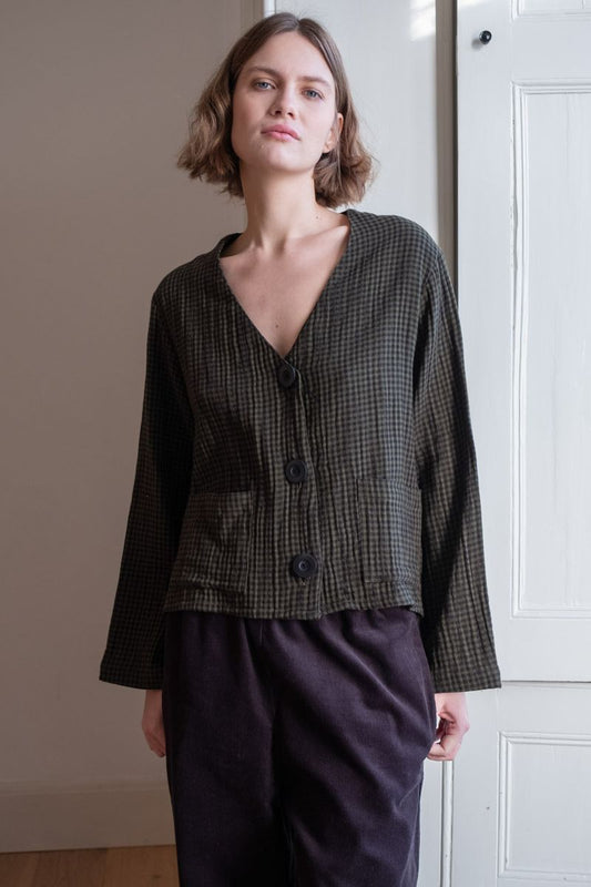 Image of model wearing BIBICO Fair Trade Clothing Irma Overshirt in Olive Checkered Gauze Cotton. 