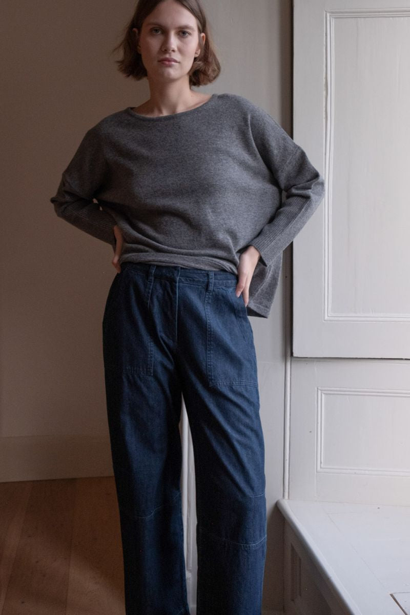 Image of model wearing BIBICO Fair Trade Clothing Margate Relaxed Barrel Leg Trouser in Heavy Indigo Denim. 