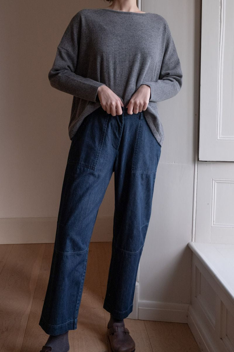 Image of model wearing BIBICO Fair Trade Clothing Margate Relaxed Barrel Leg Trouser in Heavy Indigo Denim. 