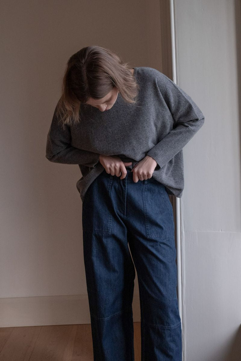 Image of model wearing BIBICO Fair Trade Clothing Margate Relaxed Barrel Leg Trouser in Heavy Indigo Denim. 