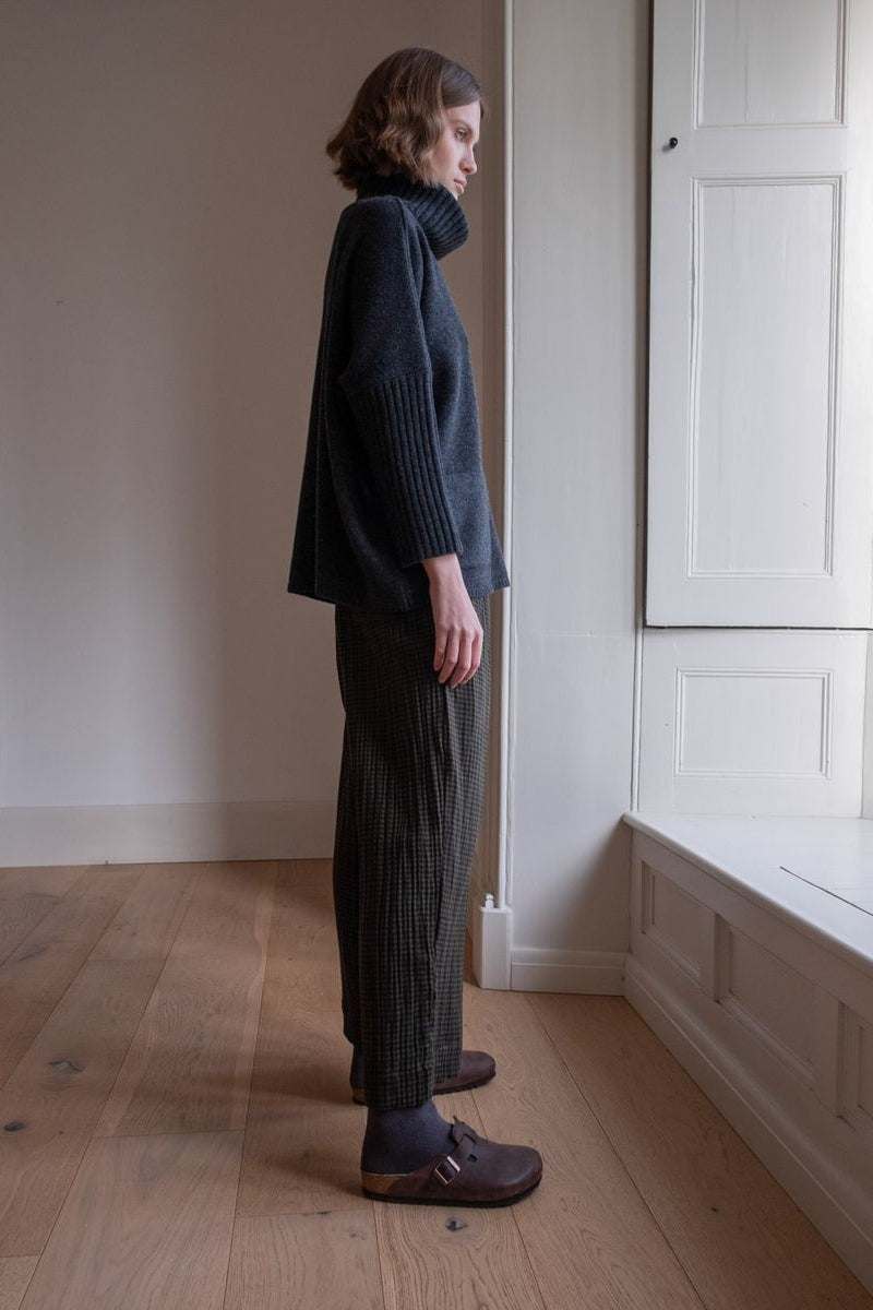 Image of model wearing BIBICO Fair Trade Clothing Orla Casual Wide Trousers in Olive Checkered Gauze Cotton