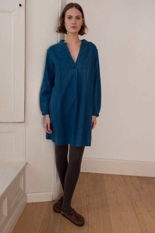 Image of model wearing BIBICO Fair Trade Clothing Wren Longsleeve Mini Dress in Textured Denim. 