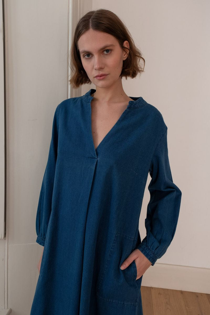 Image of model wearing BIBICO Fair Trade Clothing Wren Longsleeve Mini Dress in Textured Denim. 