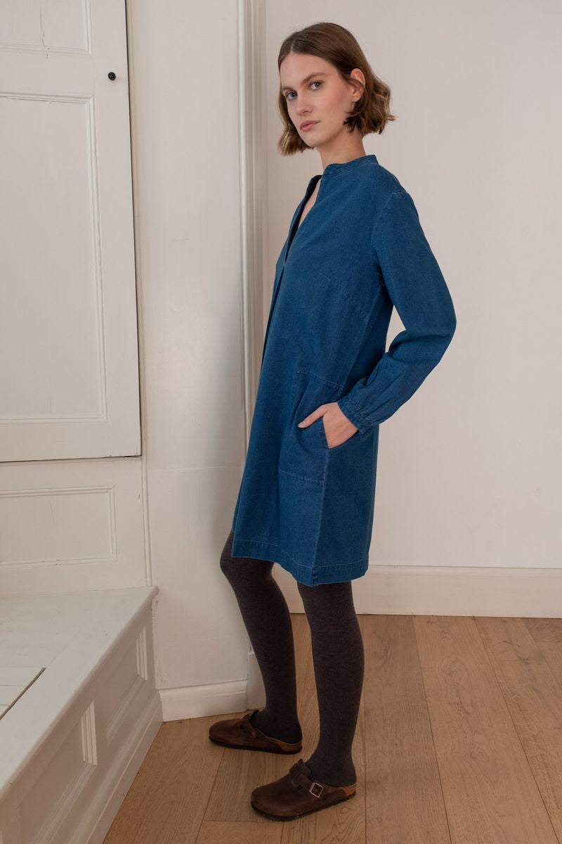 Image of model wearing BIBICO Fair Trade Clothing Wren Longsleeve Mini Dress in Textured Denim. 