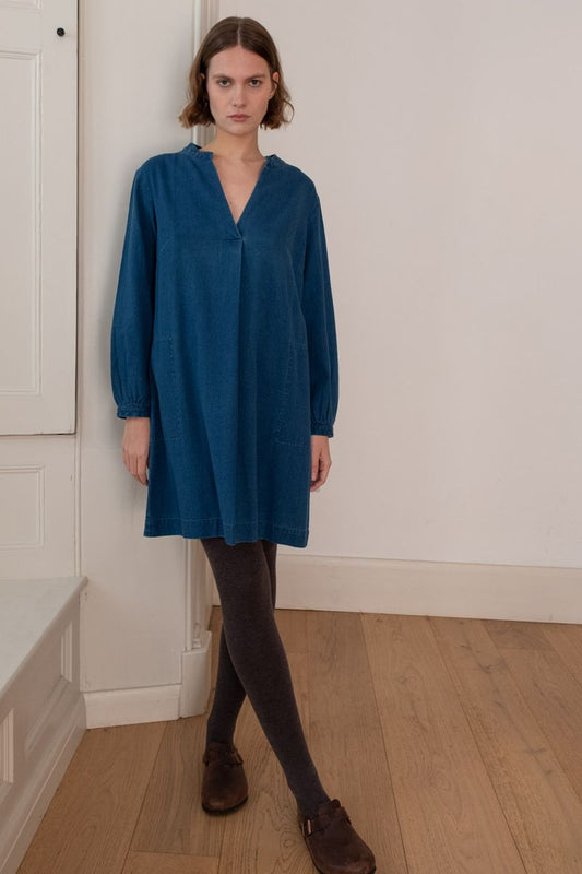 Image of model wearing BIBICO Fair Trade Clothing Wren Longsleeve Mini Dress in Textured Denim. 