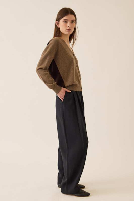 Image of model wearing DEMYLEE Abigail Color Block Cashmere Cardigan in Non-Dye and Espresso Dye Cashmere. 