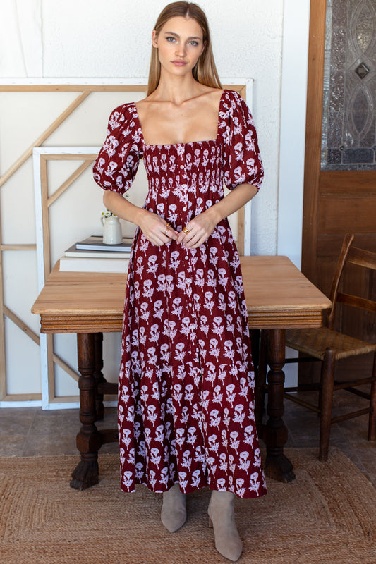 Image of model wearing EMERSON FRY LOVE TOMAS Santiago 4 Maxi Dress in Pressed Marigolds Rogue Linen. 