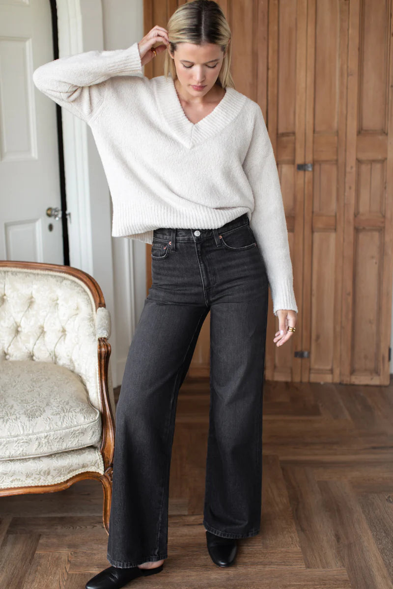 Image of model wearing EMERSON FRY TWIN DOVES DENIM Perfect Wide Leg Jean in Vintage Black Wash. Made in USA. 