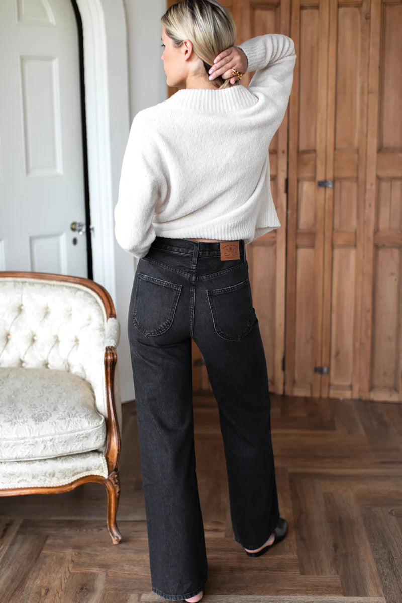 Image of model wearing EMERSON FRY TWIN DOVES DENIM Perfect Wide Leg Jean in Vintage Black Wash. Made in USA. 