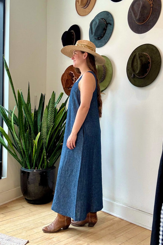 Image of IT IS WELL LA Linen Strap Sundress in Indigo. This dress has a square neckline + back, thick straps, hidden side pockets, and hits midi length. Made in USA.