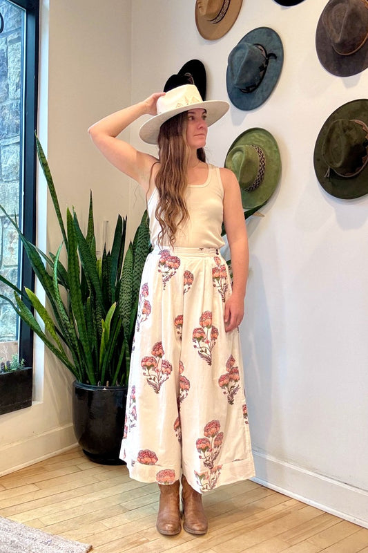 Image of model wearing MAELU DESIGNS Hand Block Printed Fleur Cotton Pant. Fleur Pants are a wide cut, culotte style trouser with a cropped length and all over floral print. 