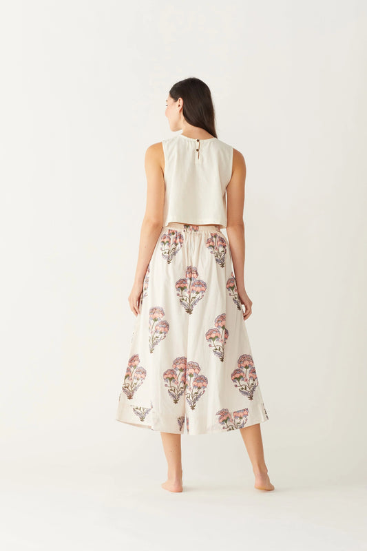 Image of model wearing MAELU DESIGNS Hand Block Printed Fleur Cotton Pant. Fleur Pants are a wide cut, culotte style trouser with a cropped length and all over floral print. 